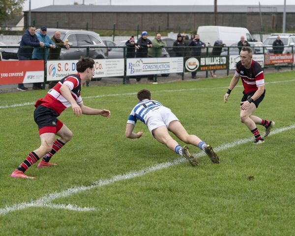 Aidan Henry dives over for one of his three tries to give Athy their first win of the season. Photo: Aisling Hyland Aidan Henry dives over for one of his three tries to give Athy their first win of the season. Photo: Aisling Hyland