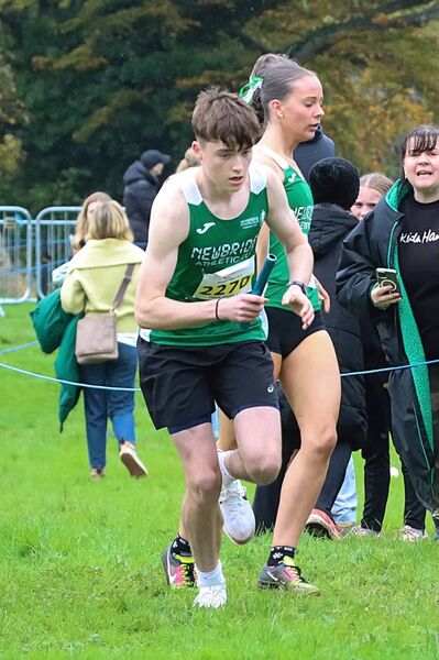 JP Archbold (Newbridge) takes over from Eabha Brennan in the U17 mixed relay Photo: Perri Williams