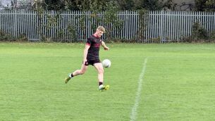 <p>Ronan Kelly scores a free today for Ardscoil Na Tríonóide </p>