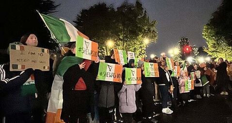 Protesters let off pink smoke during asylum demonstration at Citywest Protesters let off pink smoke during asylum demonstration at Citywest