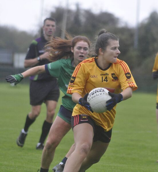Marie Kealy, who scored 0-2 for St Laurence's,  evades Miltown's Aoife Kenny as she charges up the field.  Marie Kealy, who scored 0-2 for St Laurence's,  evades Miltown's Aoife Kenny as she charges up the field.