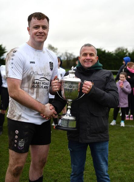 Robbie Donnelly presents the Georgina Donnelly Premier Division Cup to St Anthony's captain, Matthew Drewitt.  Robbie Donnelly presents the Georgina Donnelly Premier Division Cup to St Anthony's captain, Matthew Drewitt.