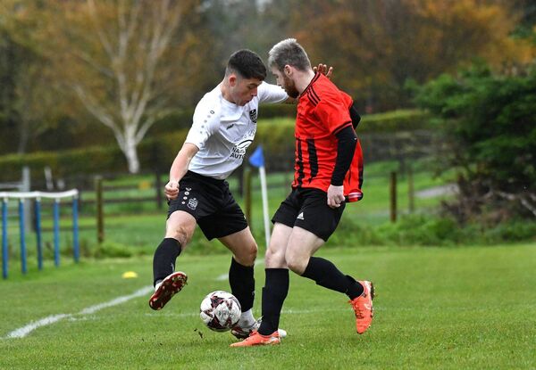 Sam Kelly (St Anthony's Youths) tries to go by Robert Burke (Kildare Town) with some trickery down the wing. Sam Kelly (St Anthony's Youths) tries to go by Robert Burke (Kildare Town) with some trickery down the wing.