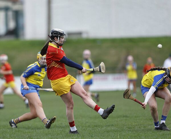 Caoimhe O'Sullivan gets a shot away for St Laurences Photo: Caoimhe O'Sullivan gets a shot away for St Laurences Photo: