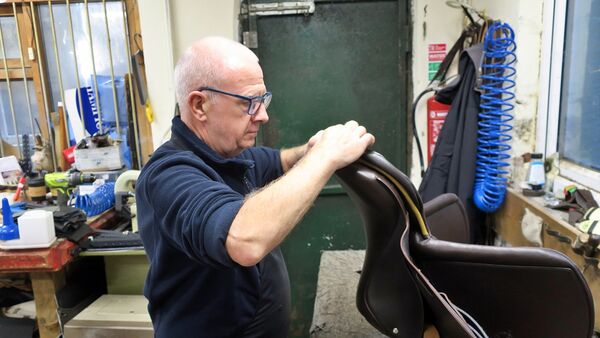 Benny completing his last saddle for Berney Bros.