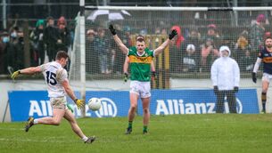 <p>Jimmy Hyland kicks the equalising point on Kerry's last visit to Cedral St Conleths Park Photo: ©INPHO/Ryan Byrne</p>