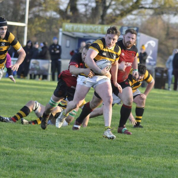 William Jennings (Newbridge) cannot break free as he is wrapped up by David Bailey (New Ross). Photo: Martin Rowe