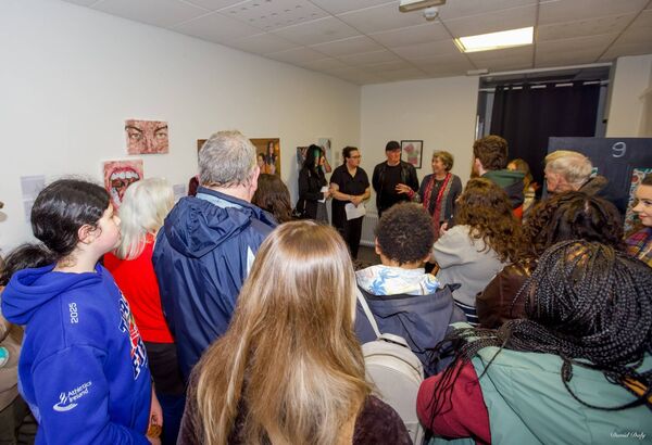 Artist Cathy Callan speaking at 'Despite it All' exhibition opening by artist Rebekah Roche 