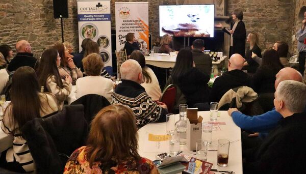Sally McCaffrey speaking at the fundraising table quiz