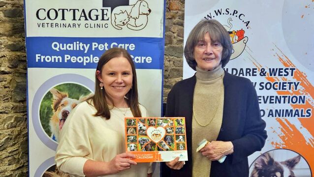 <p>Karen Piggott of Cottage Veterinary Clinic, primary sponsor of the calendar, with Anne McCaffrey of KWWSPCA</p>