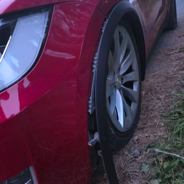 The damaged Tesla after hitting the cycle path The damaged Tesla after hitting the cycle path