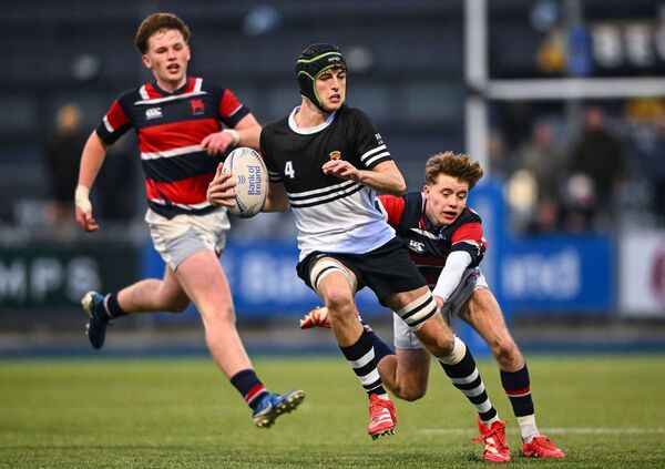 Newbridge College lock Jack Garvey evades the tackle of Zach Sidebottom (Wesley College) during the Leinster Rugby Schools Senior League Division 1A final at Energia Park, Dublin. Photo: Shauna Clinton/Sportsfile