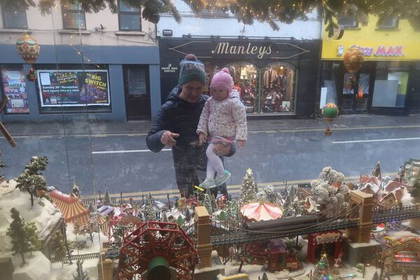 Tomasz and Amy Jaczem enjoying the Christmas Wonderland in Bradbury's window Tomasz and Amy Jaczem enjoying the Christmas Wonderland in Bradbury's window
