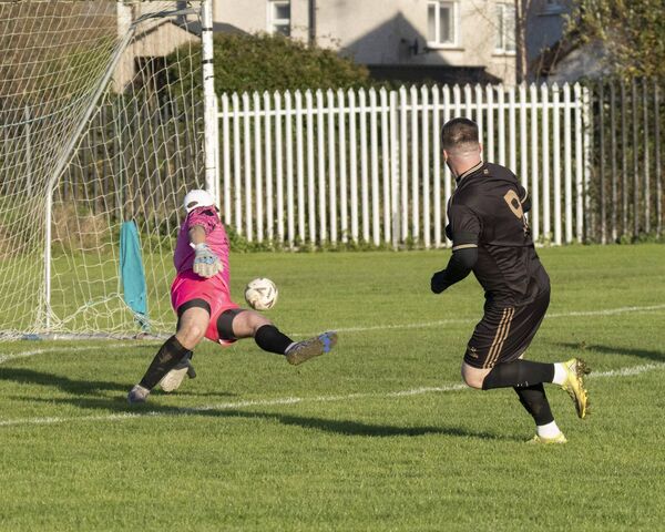 Cody Mulhall slots the ball past the Evergreen goalkeeper to give Clonmullion the lead in this year's Leinster Junior Cup. Cody Mulhall slots the ball past the Evergreen goalkeeper to give Clonmullion the lead in this year's Leinster Junior Cup.