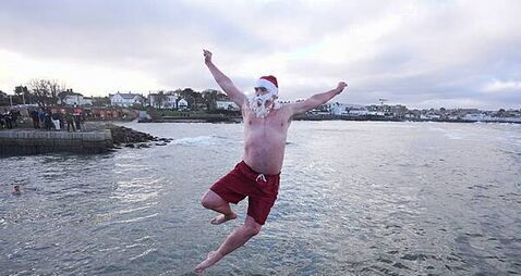 Crowds brave chilly temperatures for Christmas Day swim