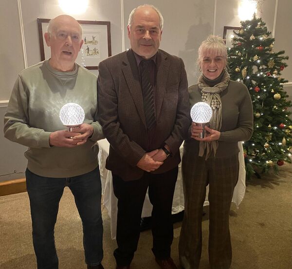 Athy Golf club bridge club Christmas competition winners Frank Whelan and Gobnait Walsh with club president Brendan Donohoe