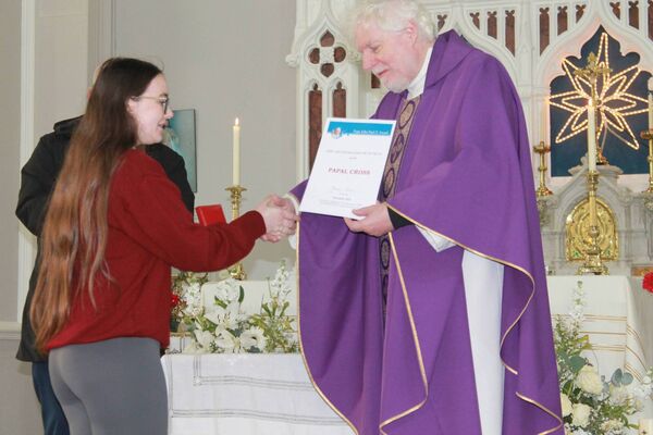 Sarah receiving her award from Fr Tom Kennedy Sarah receiving her award from Fr Tom Kennedy