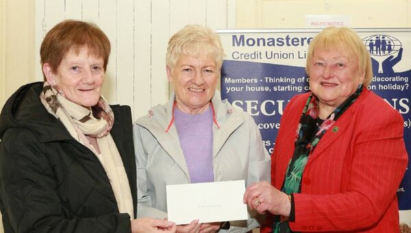 Mary Higgins and Margaret Worrell accepting a cheque from Mary Ryan, funds for Monasterevin Access Group 