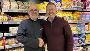 <p>Tommy Mackey with Kilcullen Eurospar owner Derek Walsh prior to his retirement</p>