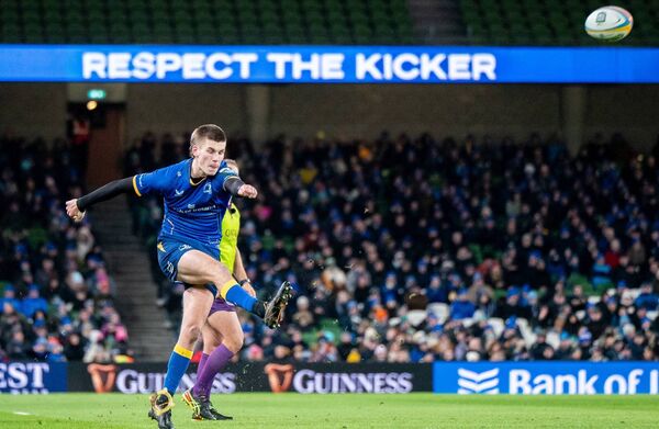 Sam Prendergast kicks a conversion for Leinster. Photo: INPHO/Henry Simpson
