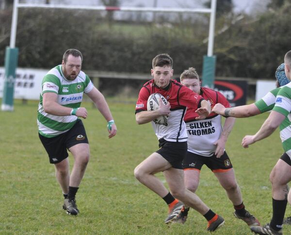 Cill Dara's William Doran breaks from the tackle of Balbriggan's Max Lennon in their Towns Cup clash in Silken Thomas Park, Kildare.