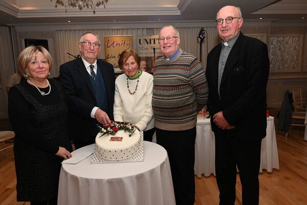 Cutting the cake. l-r Cathy Cullen, chairperson; John Fitzpatrick 96 years young; Julianne Boland 91 years young, Fr Liam Merrigan and Rev Alan Robinson 