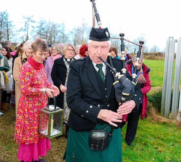 The Piper leads the procession at Solas Bhríde The Piper leads the procession at Solas Bhríde