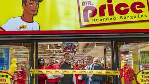 <p>Mayor of Carlow cllr Paul Doogue cuts the ribbon to open the Mr Price discount store in the Carlow Shopping Centre</p>