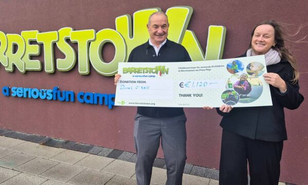 Daniel presenting Barretstown with this year’s cheque for €1,120