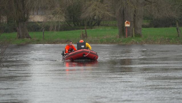 <p>Members of Kildare Civil Defence searching along the Barrow Photo: Anthony Hubbock</p>