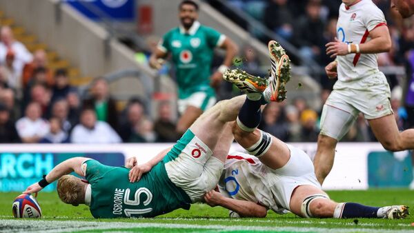 The moment Naas man Jamie Osborne grounded the ball, despite the best efforts of England's Guy Pepper, to seal victory for Ireland. Photo: INPHO/Ben Brady. The moment Naas man Jamie Osborne grounded the ball, despite the best efforts of England's Guy Pepper, to seal victory for Ireland. Photo: INPHO/Ben Brady.