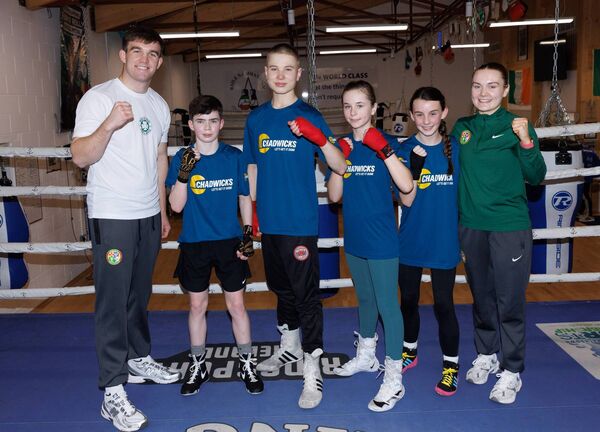 Tomás Carroll and other competition winners pose with Olympians Jennifer Lehane and Jack Marley at the Chadwicks 'Win A Training Session' event