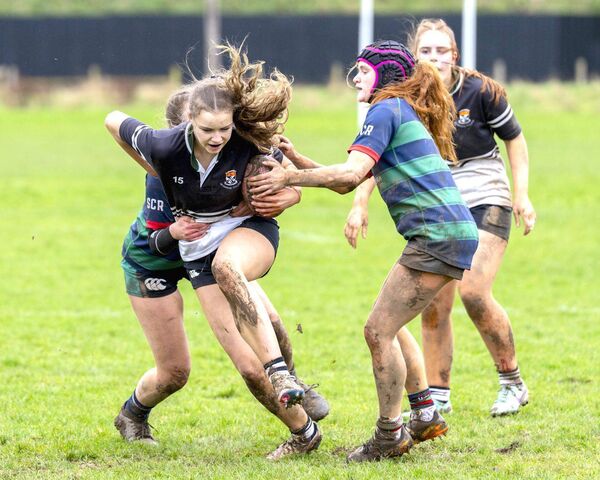 Lila Van Lonkhuyzen attemps to break the Scoil Chríost Rí defensive line for Newbridge College.