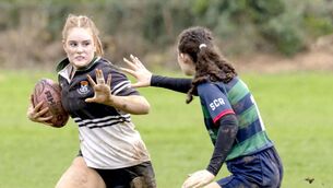 <p>Faye Kavanagh makes ground for Newbridge College as she prepares to hand off the tackle of Portlaoise winger Grainne Ramsbottom. All Photos: Aisling Hyland</p> <p>Faye Kavanagh makes ground for Newbridge College as she prepares to hand off the tackle of Portlaoise winger Grainne Ramsbottom. All Photos: Aisling Hyland</p>