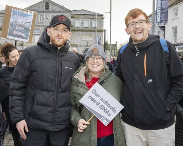 Oisin and Cian Boylan with Susan Laverty at the protest
