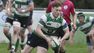 <p>Scrum half Tadhg Brophy takes the ball to the line for Naas. </p>