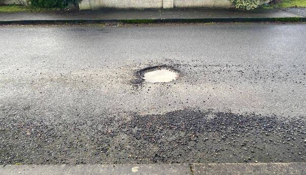 A pothole in the middle of the estate's road