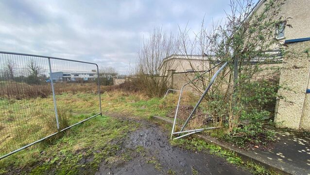 <p>A broken fence leads to the vacant plot of land adjacent to the estate, which is now alleged to be attracting anti-social behaviour</p>