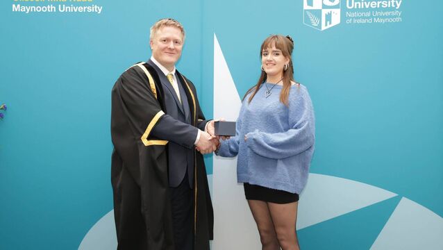 <p>Former Newbridge College student Tia Donovan receiving a Maynooth University Entrance Scholarship, pictured here with Professor Ronan Farrell, Maynooth University Vice President Academic and Registrar</p>