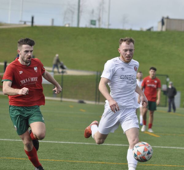 Eoin O'Neill, Monread's opening goal-scorer, takes the ball away from Glasnevin's Aaron McGlue in the Larney Baker Cup in Kerdiffstown Park.