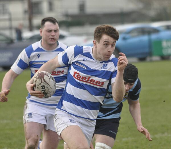 Athy full back Aidan Henry makes a break for his side's opening try. Photos: Martin Rowe.