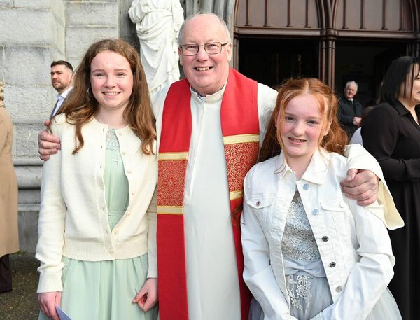 Taylor Ryan and Rhona Stafford with Fr Liam Merrigan PP Monasterevin 