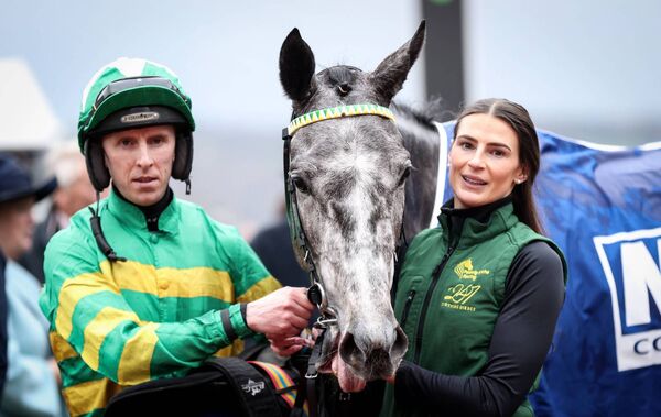 Clane jockey Mark Walsh on Saratoga celebrates winning the McCoy Contractors Juvenile Handicap Hurdle with groom Katie Young. Photo: INPHO/Tom Maher