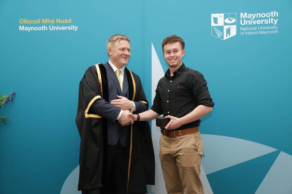 Former Scoil Dara, Kilcock student Seán Ryan receiving the scholarship, 