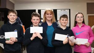<p>Scoil Comcill Naofa, Moone with a representative of their local credit union</p>