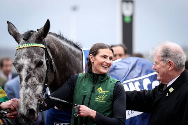 Owner JP McManus has a word of congratulations for groom Katie Young after Saratoga's success Photo: ©INPHO/Tom Maher