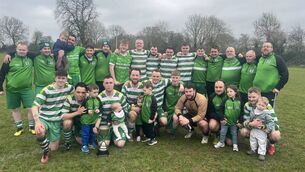 <p>The Mill Celtic squad, along with some of their children, celebrate winning the Division 2 crown. </p>
