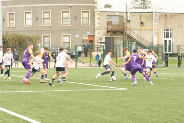 Charlie McCann makes an important block in the Klub Kildare goalmouth
