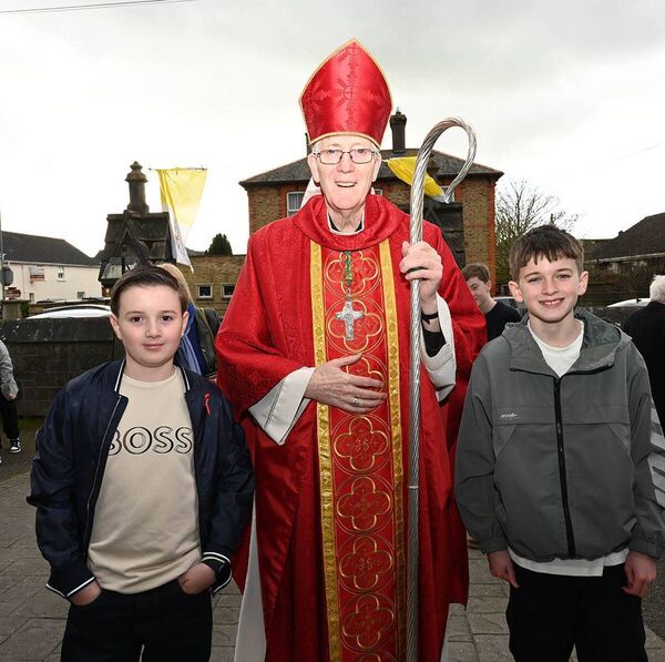 Brody and Rían O'Reilly wit Bishop Denis Nulty 