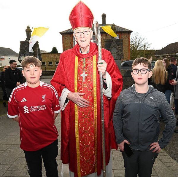 Caolán Dunne and Charlie Staford with Bishop Denis Nulty 